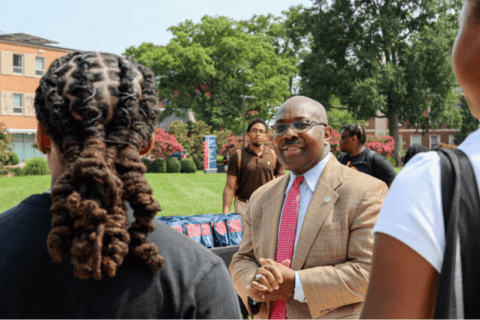Provost Anthony Wutoh greeting students on The Yard by Devante Kennedy.png